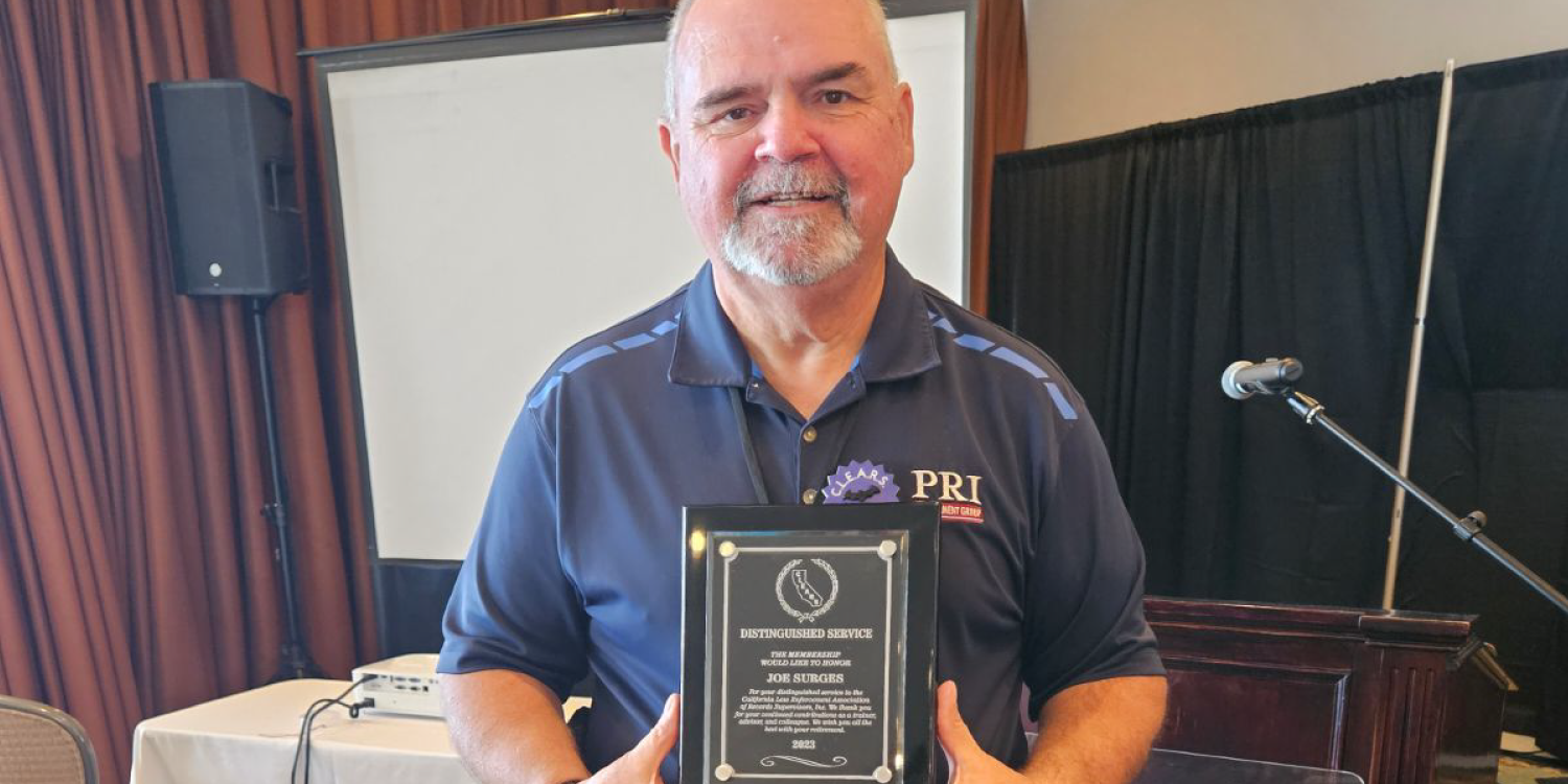 CLEARS Member Holding Commemorative Plaque CLEARS Member Holding Commemorative Plaque
