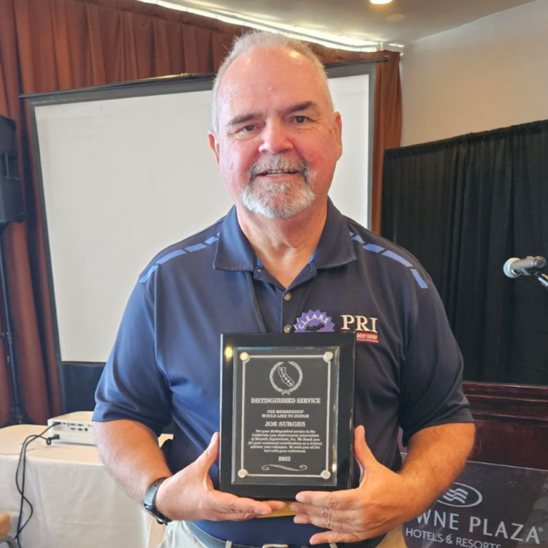 CLEARS Member Holding Commemorative Plaque CLEARS Member Holding Commemorative Plaque