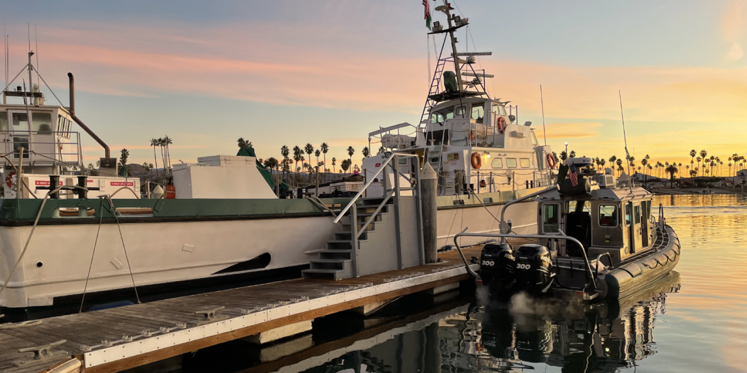Docked Boats in Harbor at Sunset Docked Boats in Harbor at Sunset