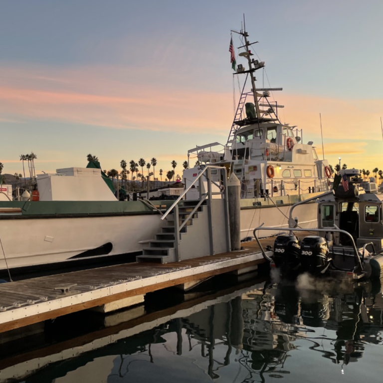 Docked Boats in Harbor at Sunset Docked Boats in Harbor at Sunset